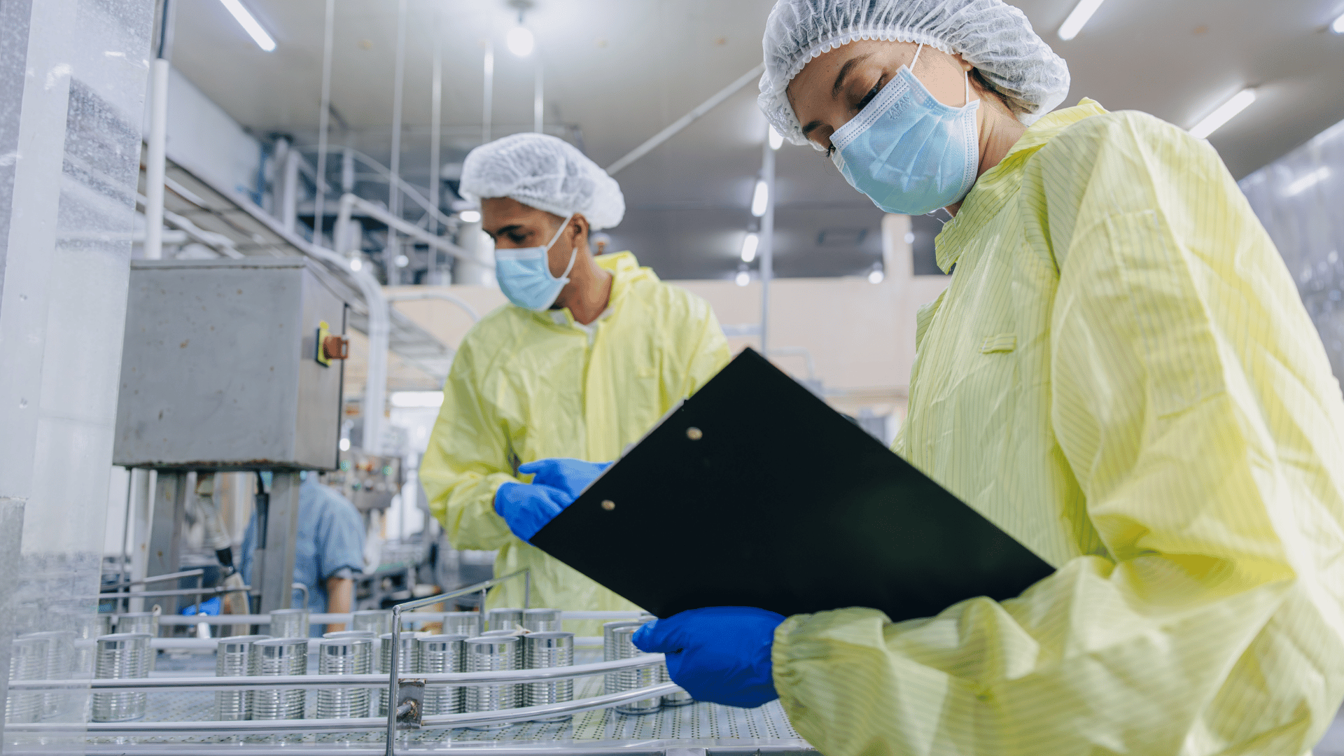Quality engineers inspecting medical device manufacturing on the production line
